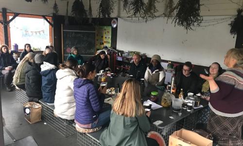 Summer Home Medicine workshop gathering of participants inside the outdoor classroom at Laudato Si Centre